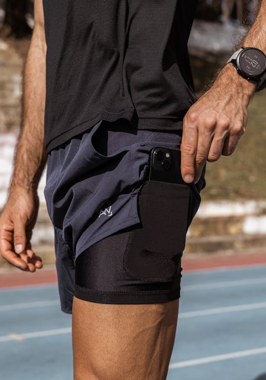 Running shorts chafing fix — split shorts with liner on track in afternoon light