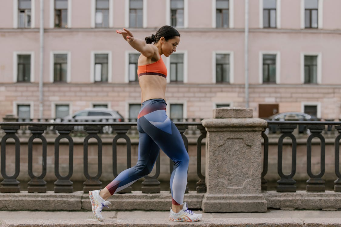 Running tights editors pick — close fit running tights on track at dawn