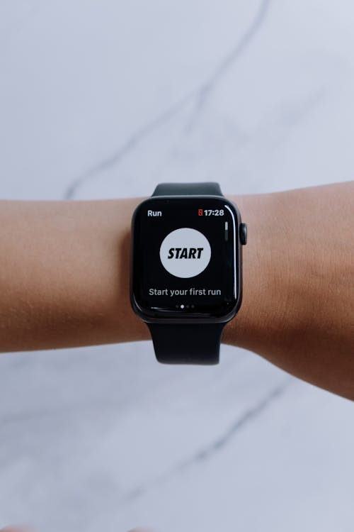 Refurbished running watches test — GPS watch being inspected out of box
