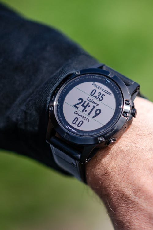 Best GPS running watch editors pick — watch on wrist during morning run