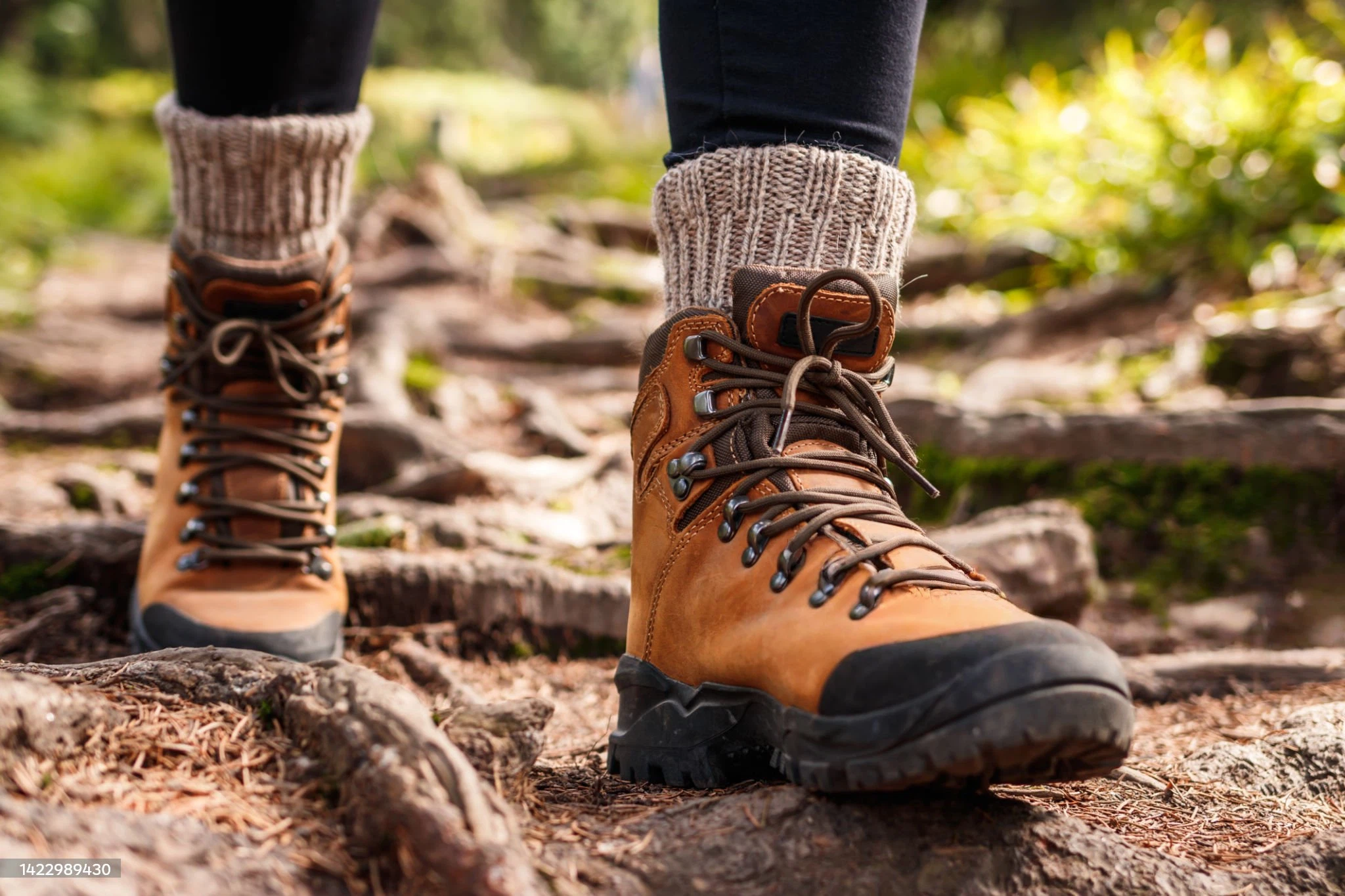 Best hiking boot editors pick — trail boot on rocky mountain terrain close up