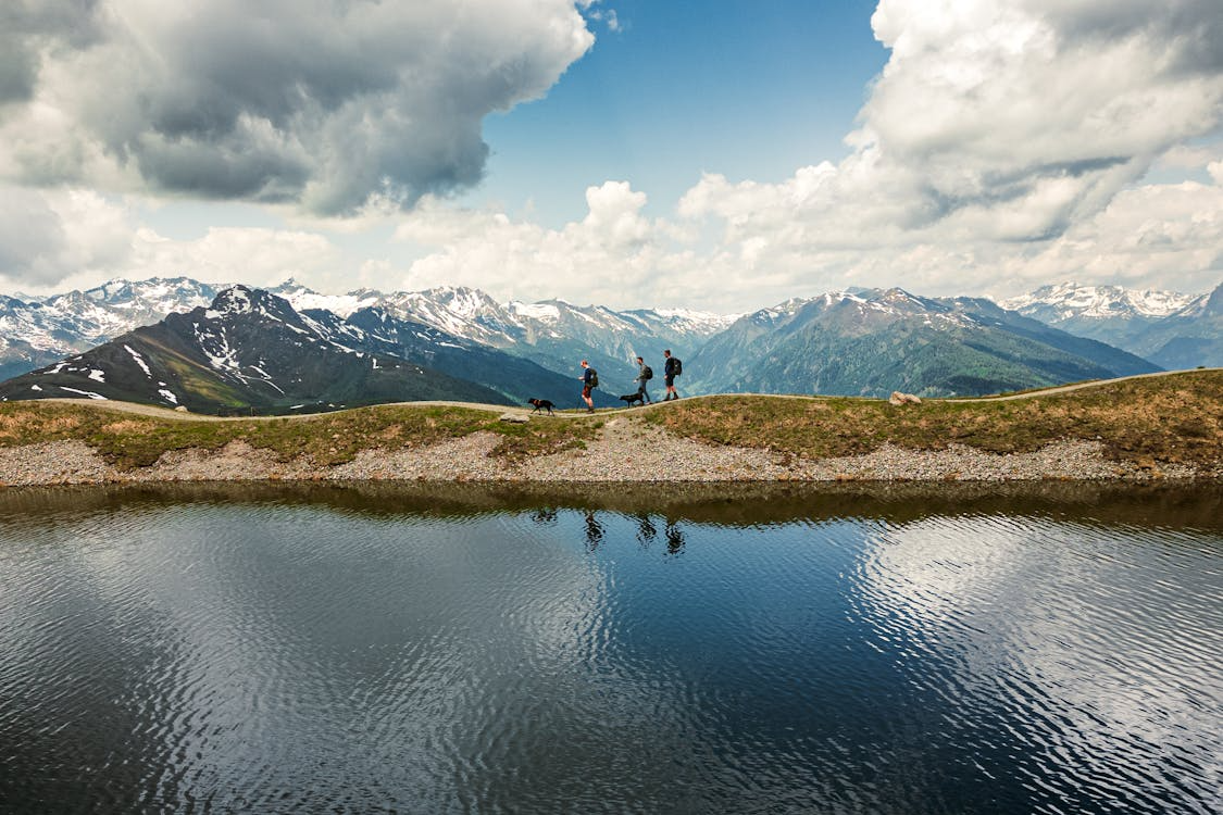 Alpine hiking layering guide — three layer system base mid shell on mountain