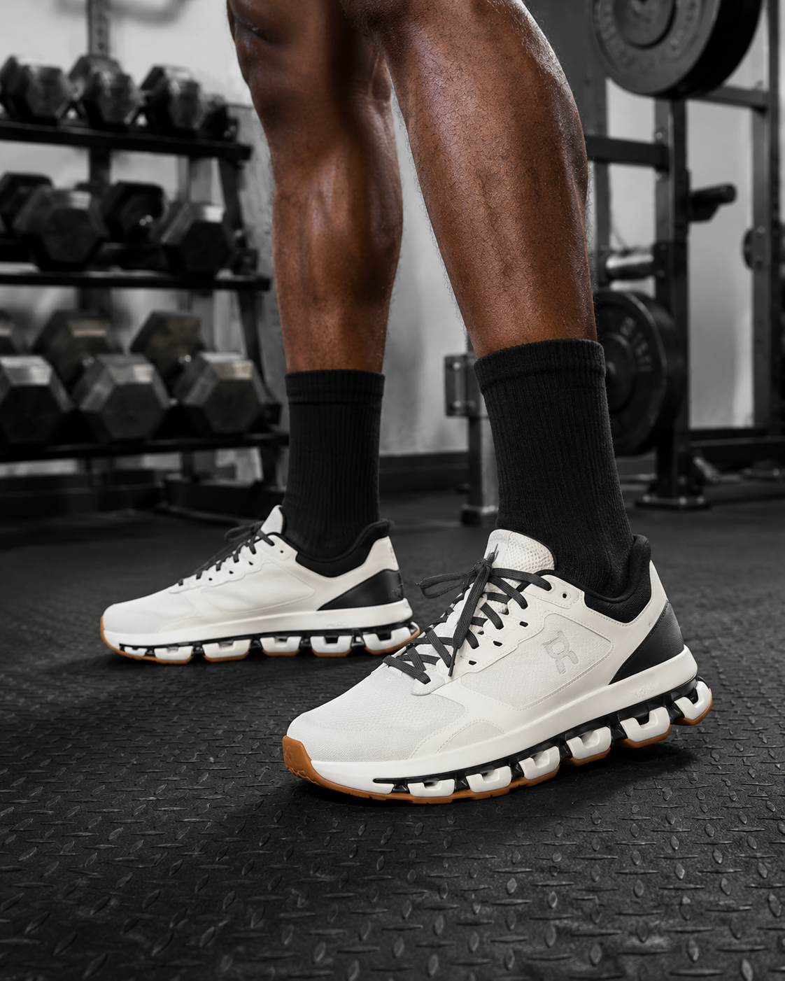 Best gym shoes for men 2026 — flat training shoe on black rubber gym floor near barbell
