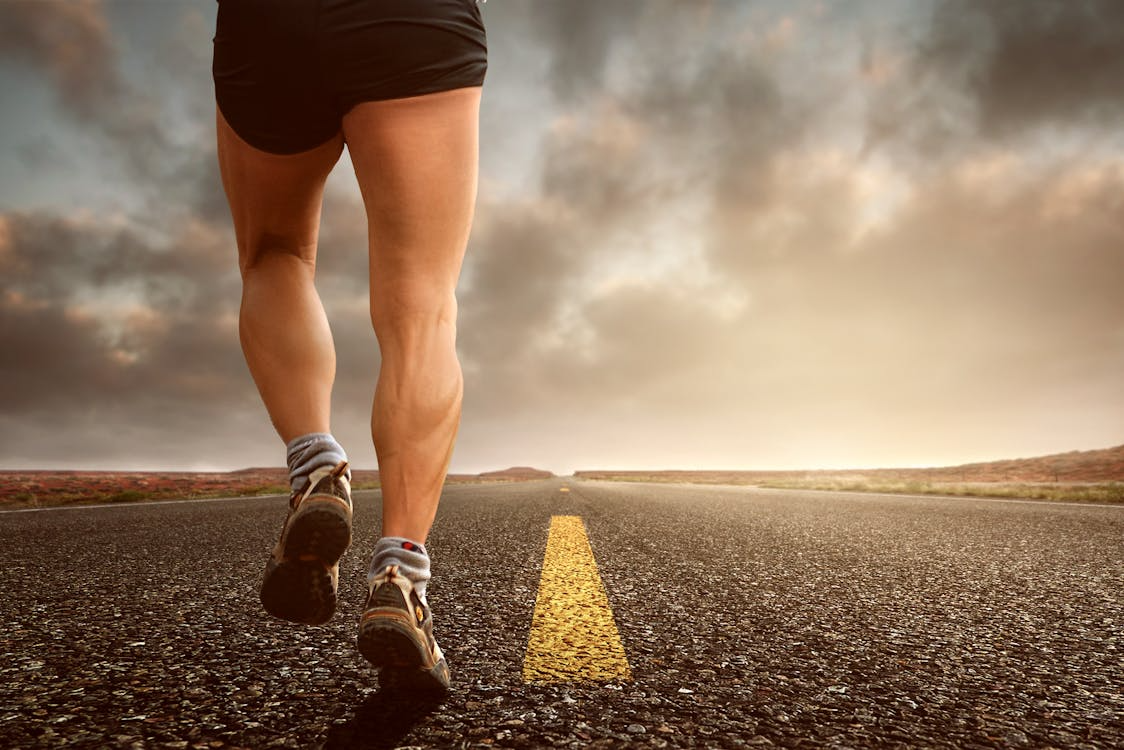Dead legs on long runs fix — runner on trail showing fatigue at mile 18